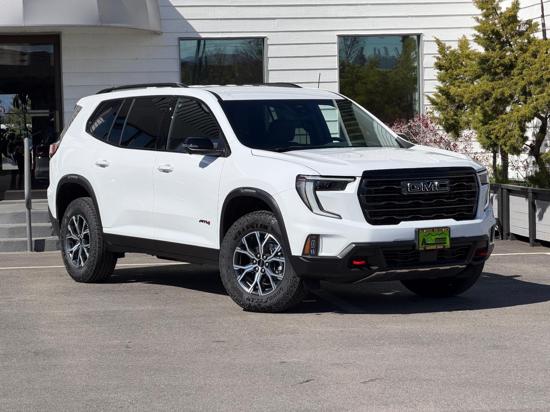 2026 GMC Acadia AWD AT4 in Summit White — front three-quarter view